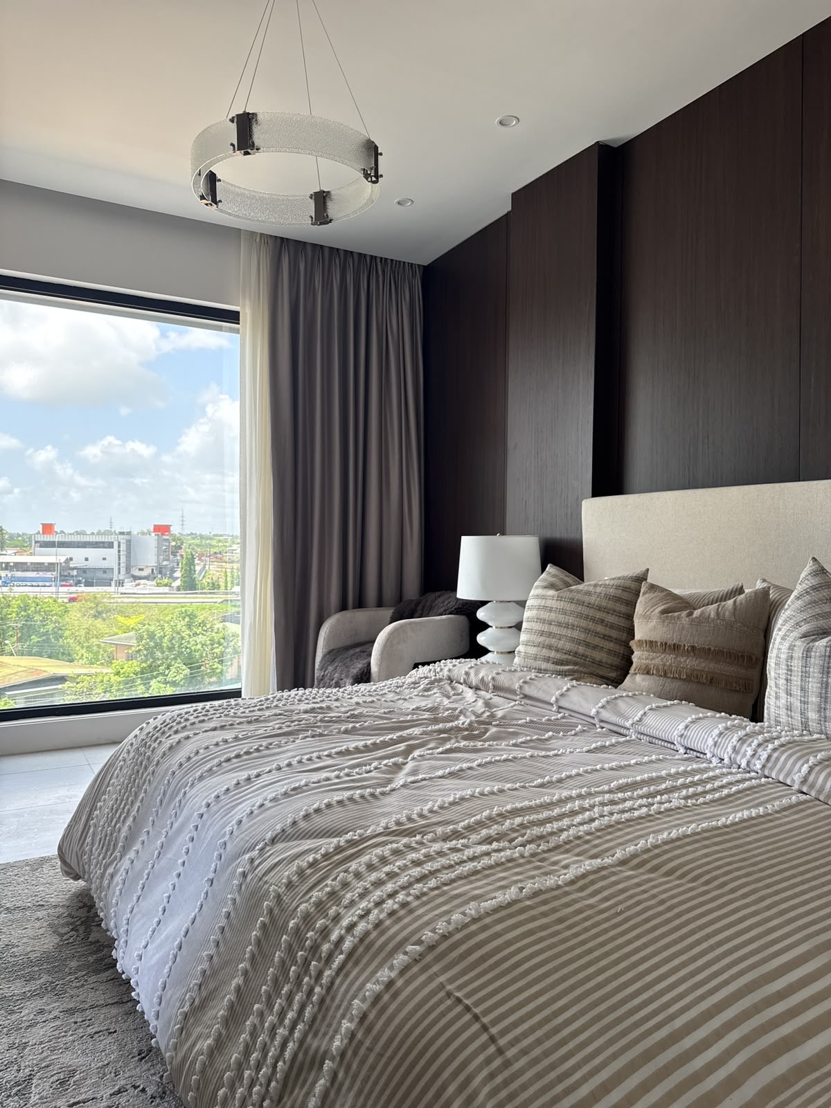 Bedroom with expansive windows and views