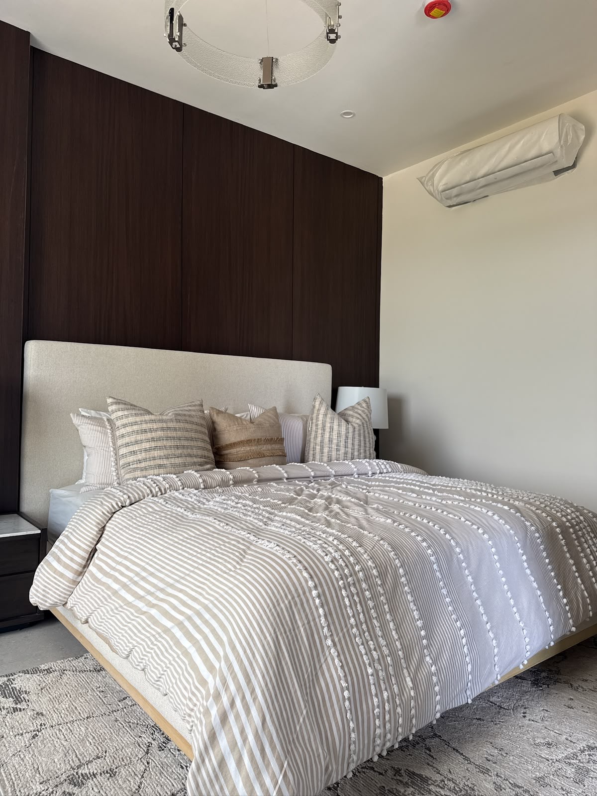 Bedroom with contemporary wood feature wall